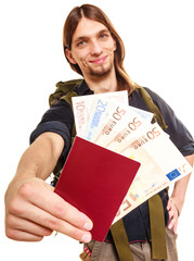 Man tourist backpacker holding money and passport.