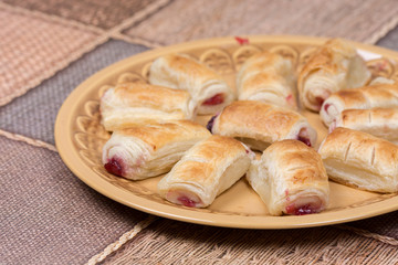 Cherry cream puff pastry served on the plate