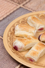Cherry cream puff pastry served on the plate