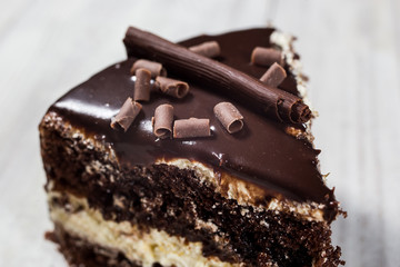 chocolate cake with Candied Oranges,Chocolate cake with a cut piece and blade on gray background, closeup,Dark chocolate cake,Delicious vegan chocolate cake,Tasty chocolate cake on wooden background