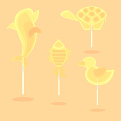 Caramel candy on a stick in the form of cartoon animals for kids and for the holidays