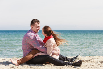 Happy couple having date on beach