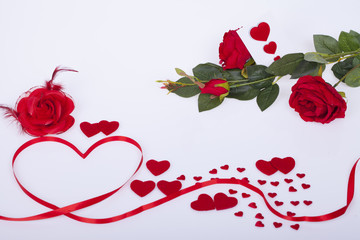 Red ribbon with hearts  on a white background