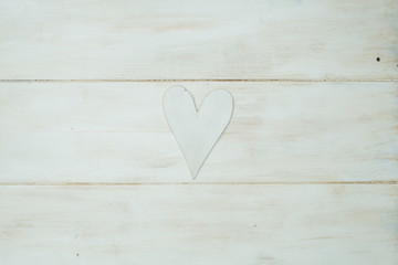 white heart on a white background, wood painted  Greek blue in v