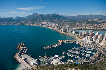 Obraz premium View over Calpe (Calp) town, Spain. Shot from the Penon ( Ifach) rock, overlooking the coast, the harbor, lake and the city
