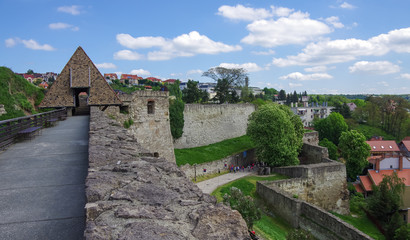 Fototapeta na wymiar Walls and main gate of rampart of the Eger fort (castle) with medieval town of Eger at background . Hungary