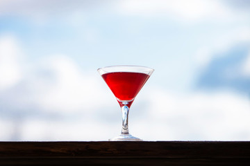 Red cocktail in the glass