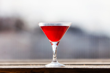 Red cocktail in the glass