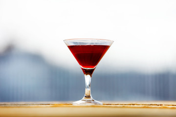 Red cocktail in the glass