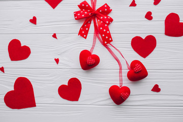 valentines day. red hearts and presents  on white wooden background 