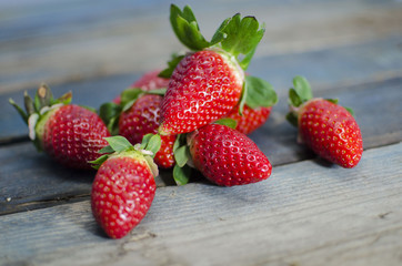 Fresh strawberries on old wooden table