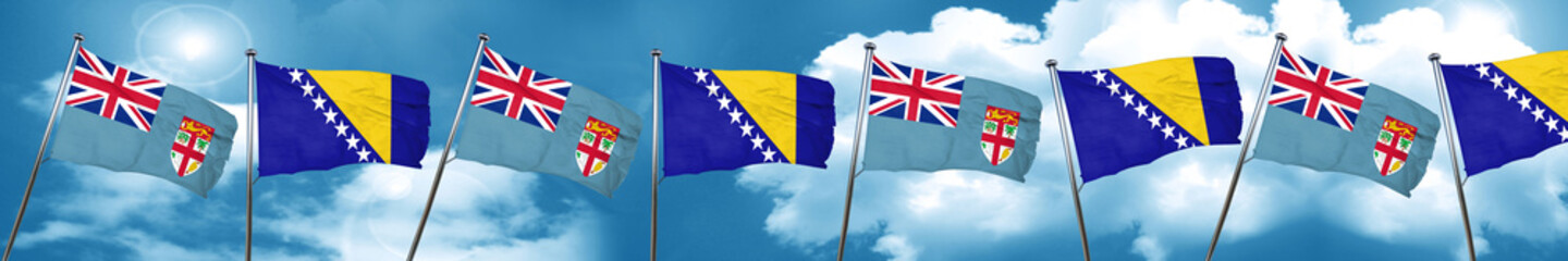 Fiji flag with Bosnia and Herzegovina flag, 3D rendering