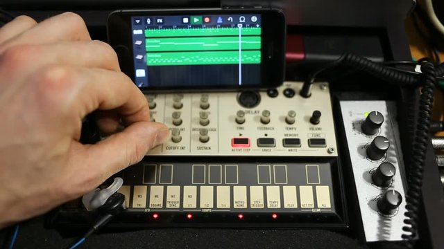 Rows Of Analog Midi Controllers. Tons Of Tumblers For computer music sounds More Groovy. Close - Up Shot Of professional musical devices tumblers and Indicators for setting sound, sound equalizing