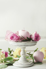 Colourful apples and flowers on stand