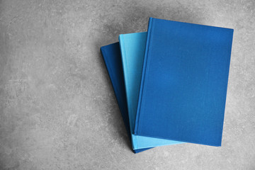 New hardcover books on gray background