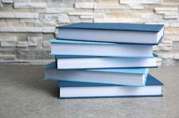 Pile of books on gray table