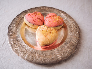 	The cakes in the form of hearts on plate