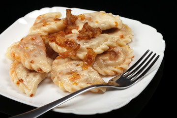 Traditional Ukrainian dumplings with bacon