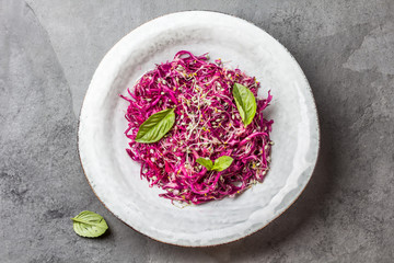 Cabbage salad with soybean sprouts and edible garlic flowers