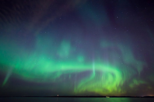 Northern lights over lake in finland