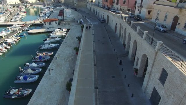 Flight on the pier of a small town in Italy
Drone in the city on the road along the pier