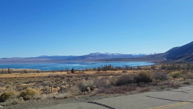 Pan view of a landscape and the mono lake, in autumn, at Mono lake, in California, United states of America