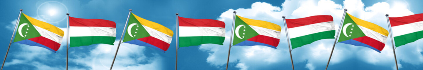 Comoros flag with Hungary flag, 3D rendering