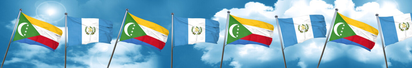 Comoros flag with Guatemala flag, 3D rendering