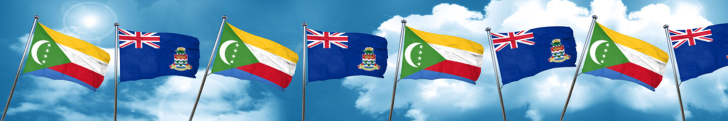 Comoros flag with Cayman islands flag, 3D rendering