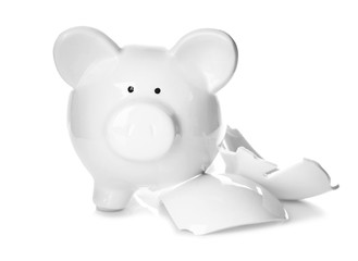 Broken piggy bank on white background