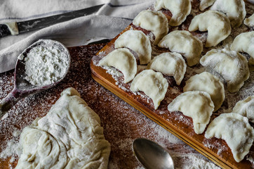 homemade dumplings with berries, cheese, potatoes