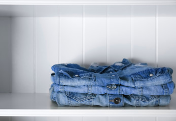 Stack of clothes on shelves