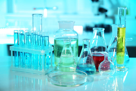 Chemical glassware with samples on table at laboratory