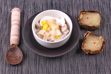 Nian gao dumplings and taro in coconut cream.