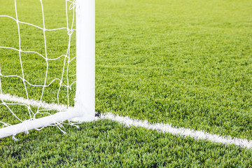 Soccer goal with grass field.