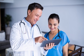 Doctors using digital tablet