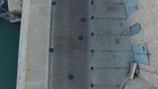 Flight on the pier on a beautiful day
Drone in the city on the road along the pier