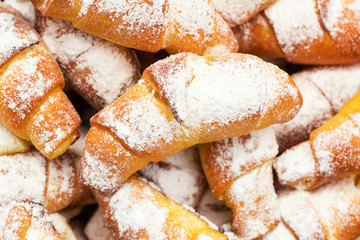 Fresh, delicious, sweet croissants with powdered sugar.