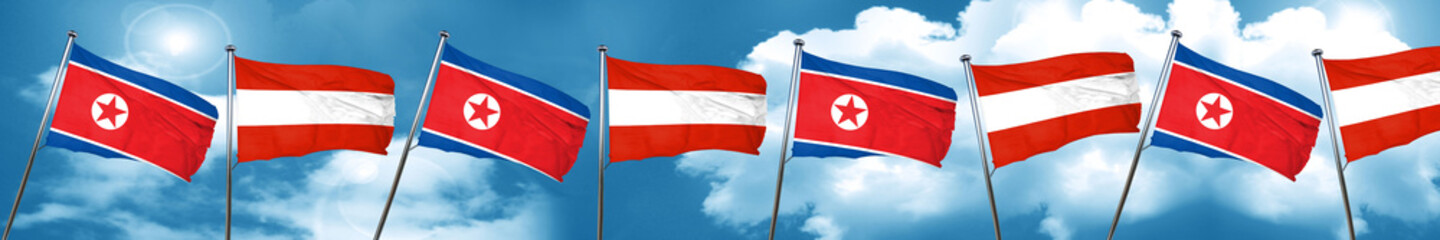 North Korea flag with Austria flag, 3D rendering