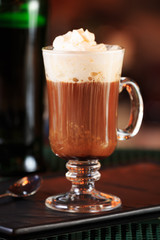 Irish coffee in a bar. Concept of St Patrick holiday. Holiday ba