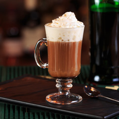 Irish coffee in a bar. Concept of St Patrick holiday. Holiday ba