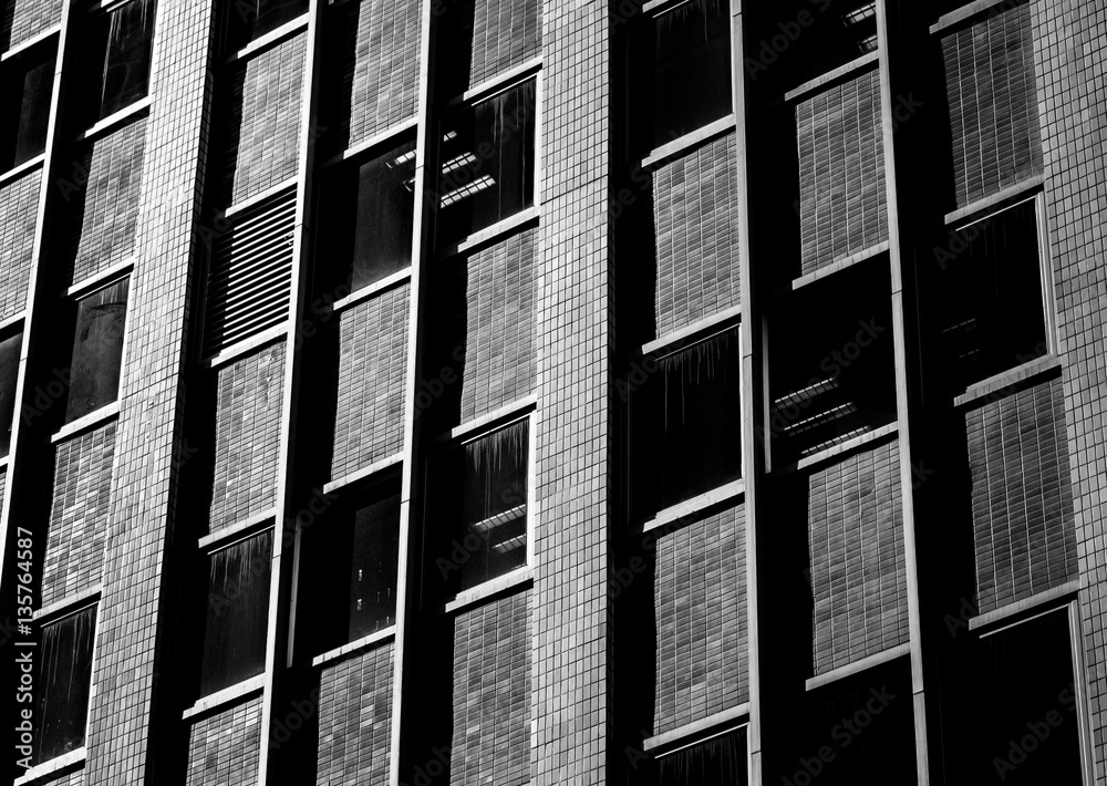 Wall mural windows of commercial building in hong kong with b&w color