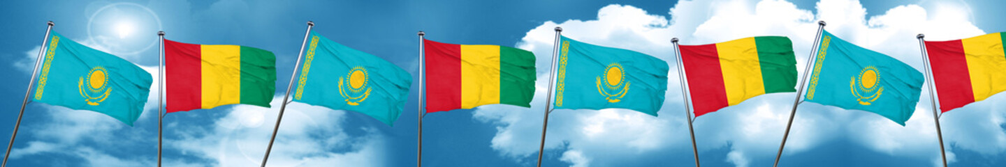 Kazakhstan flag with Guinea flag, 3D rendering