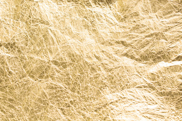 Gold wrinkled paper texture abstract background