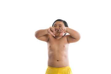 Fototapeta premium Cute little boy standing and looking at camera, enjoy playing.