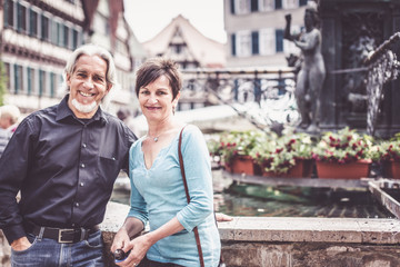 Senior Couple Walking Through The Streets Of Tuebingen