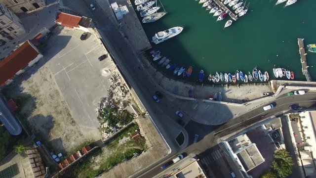 Flying over the city to the harbor
Drone in the city on the road along the pier