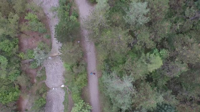 Flight of the boys walking on a path
Drone on the mountains in a mild winter
