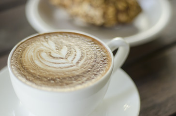 Barista making a cup of coffee soft focus image .
