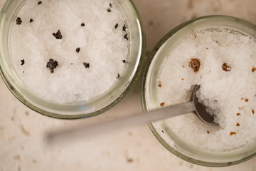 Overhead of Two Jars of Truffle Salt and a Spoon